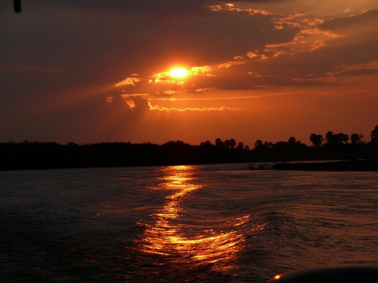 Free stock image of African sunset on river created by John Metzger