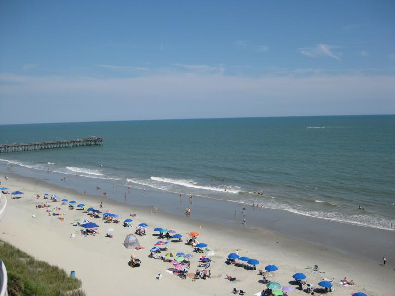 Free stock image of Overlooking the crowded beach created by John Boker