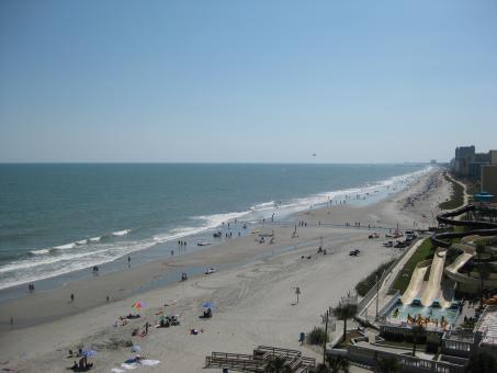 Overlooking the crowded beach - Free Stock Photo
