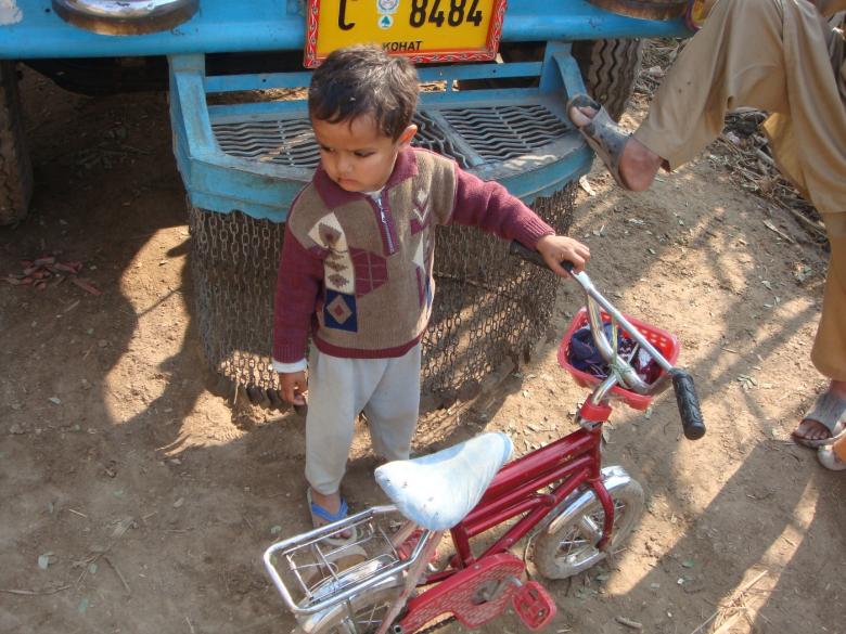 Free stock image of Baby boy with bike created by Ali Haider