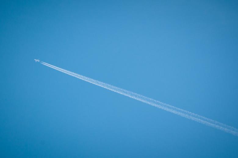 Free stock image of airplane flying through blue sky created by Luka