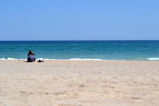 Couple on the beach - Free Stock Photo