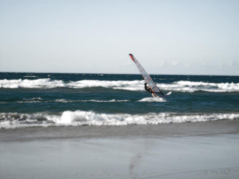 Free stock image of Windsurfing in waves created by Nicholas Spaggiari