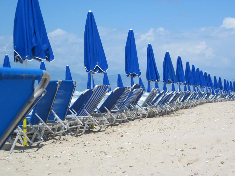 Free stock image of Sunbeds and umbrellas on the beach created by Boris Kyurkchiev