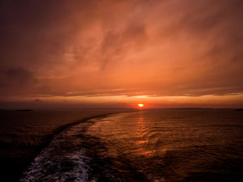 Free stock image of Ferry leaves behind the trail created by Janis Urtans