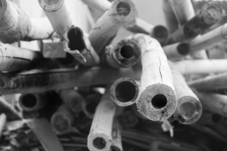 Free stock image of Stack of bamboo at a construction site created by Katriona Galahad