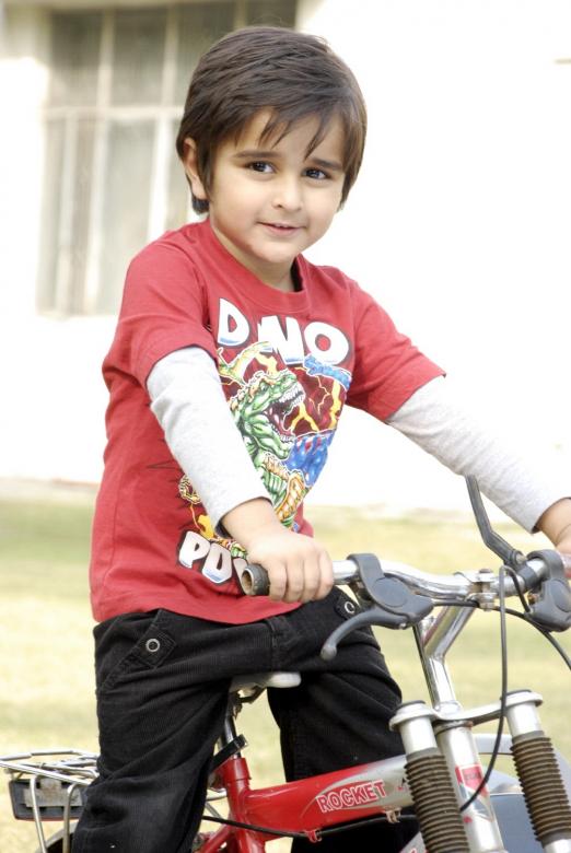 Free stock image of Cute Kid with Bicycle created by Bilal Aslam