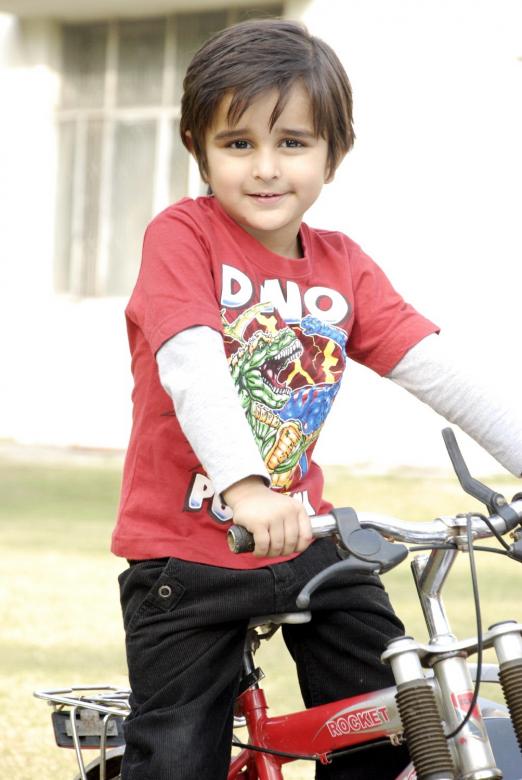 Free stock image of Cute Kid with Bicycle created by Bilal Aslam