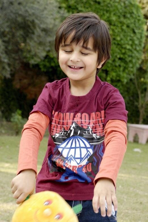 Free stock image of Cute Kid Playing in the Lawn created by Bilal Aslam