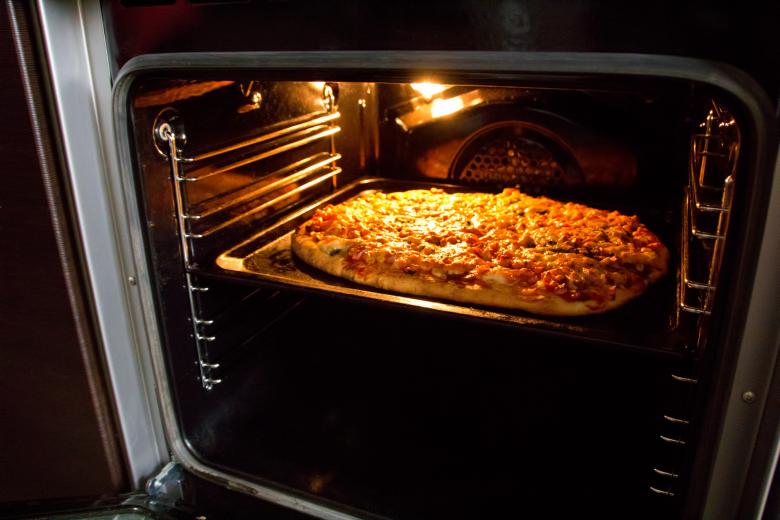 Free stock image of Pizza in oven created by 2happy