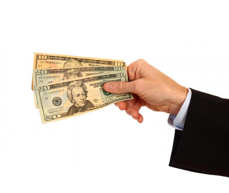 Free stock image of A Hand Holding Money created by Benjamin Miller
