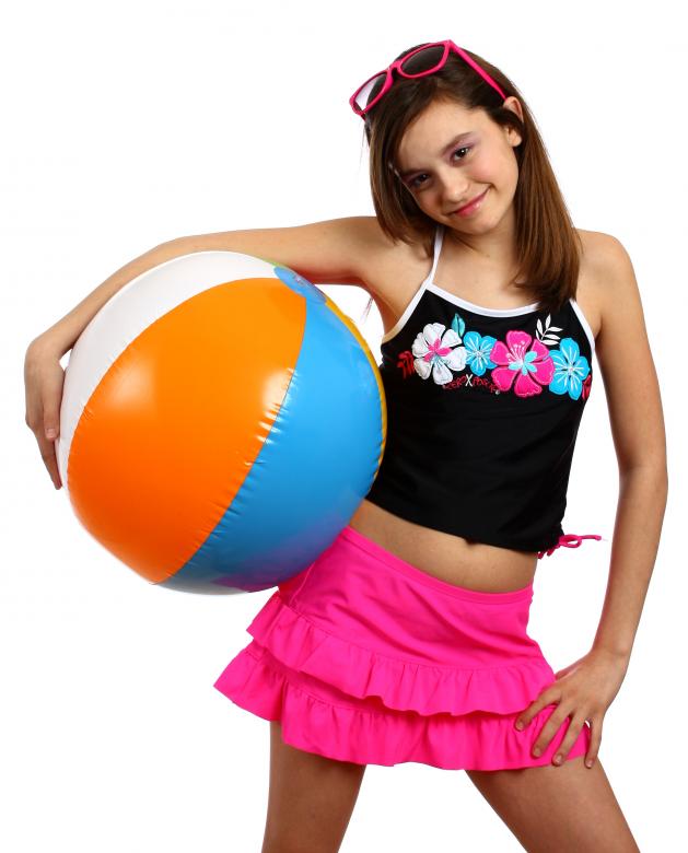 Free stock image of A young girl posing with a beach ball created by Benjamin Miller