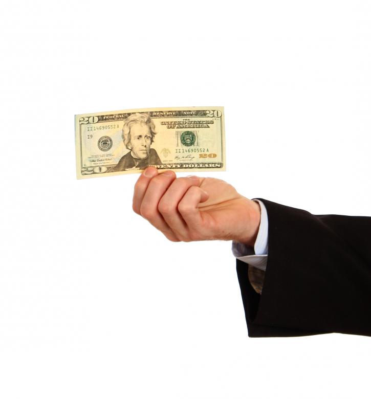 Free stock image of A hand holding a twenty dollar bill created by Benjamin Miller