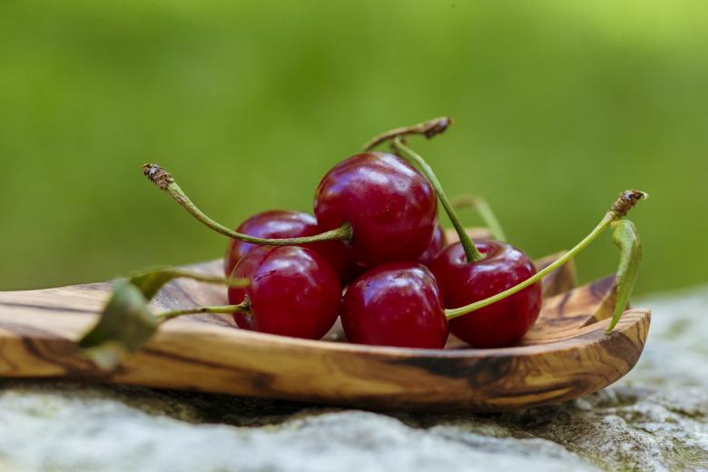 Free stock image of Cherries in wooden spoon created by Oksana Zahray