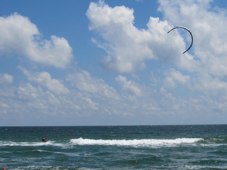 Free stock image of A kitesurfer at sea created by Boris Kyurkchiev