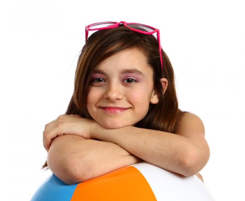 Free stock image of A young girl posing with a beach ball created by Benjamin Miller