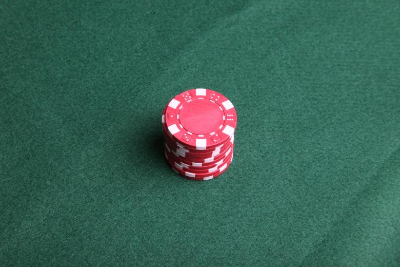 Free stock image of Red poker chips on green felt. created by Jared Davidson