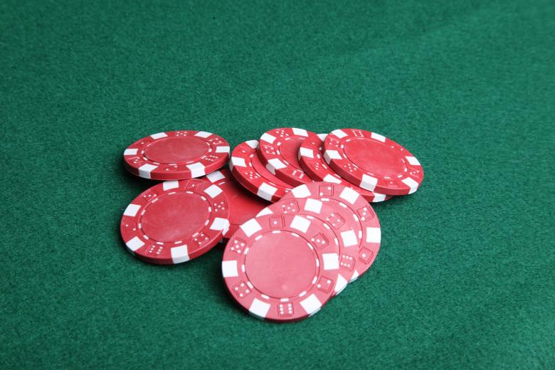 Free stock image of Red poker chips on green felt. created by Jared Davidson