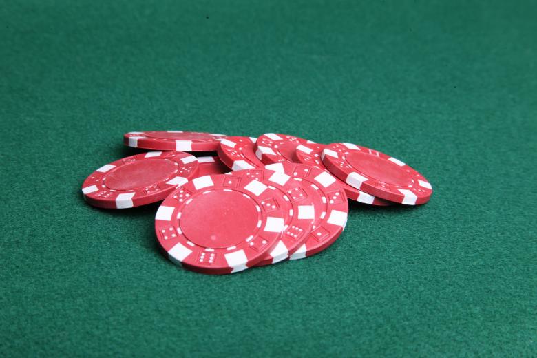Free stock image of Red poker chips on green felt. created by Jared Davidson