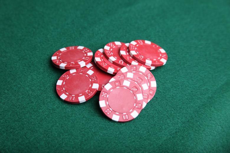 Free stock image of Red poker chips on green felt. created by Jared Davidson
