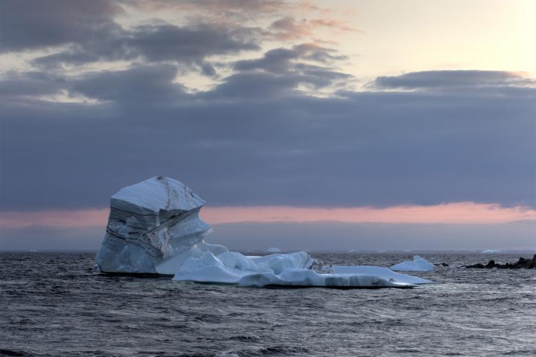 Free stock image of Iceberg Floating at Dusk created by Geoffrey Whiteway