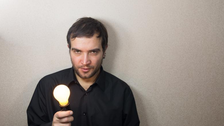 Free stock image of Man holding light bulb created by Mudretsov Olexandr