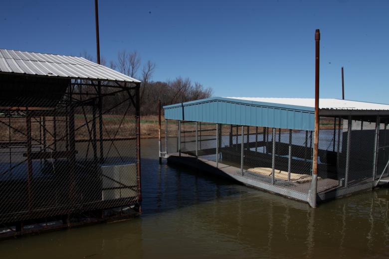 Free stock image of Boathouses on the lake created by Jared Davidson
