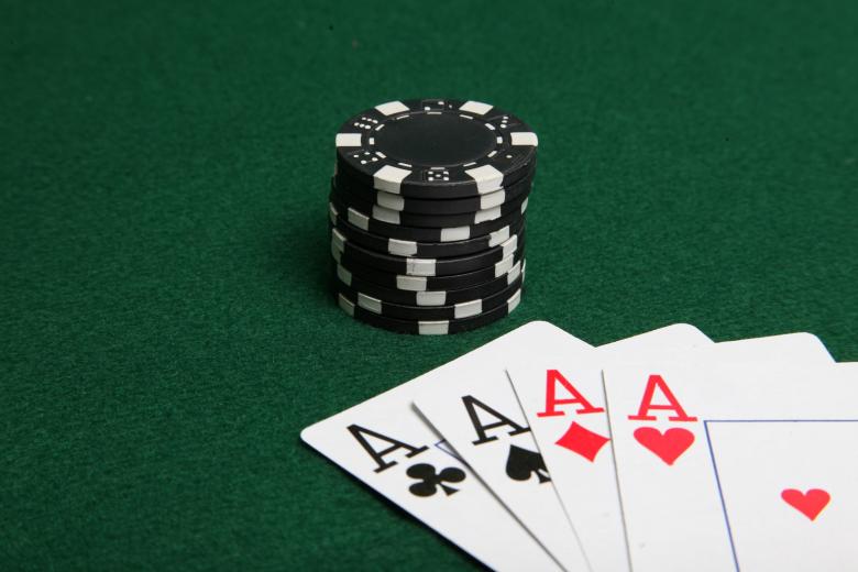 Free stock image of Stack of black poker chips with four ace created by Jared Davidson