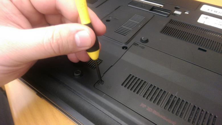 Free stock image of Hand holding a laptop screwdriver created by Jared Davidson