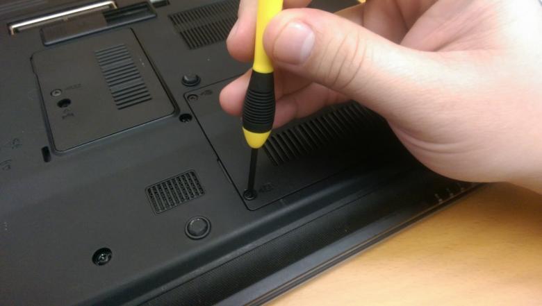 Free stock image of Hand holding a laptop screwdriver created by Jared Davidson