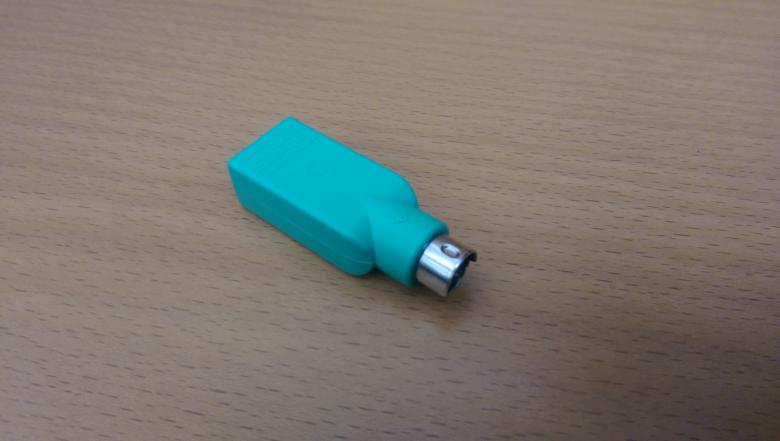 Free stock image of PS2 to USB converter on table created by Jared Davidson
