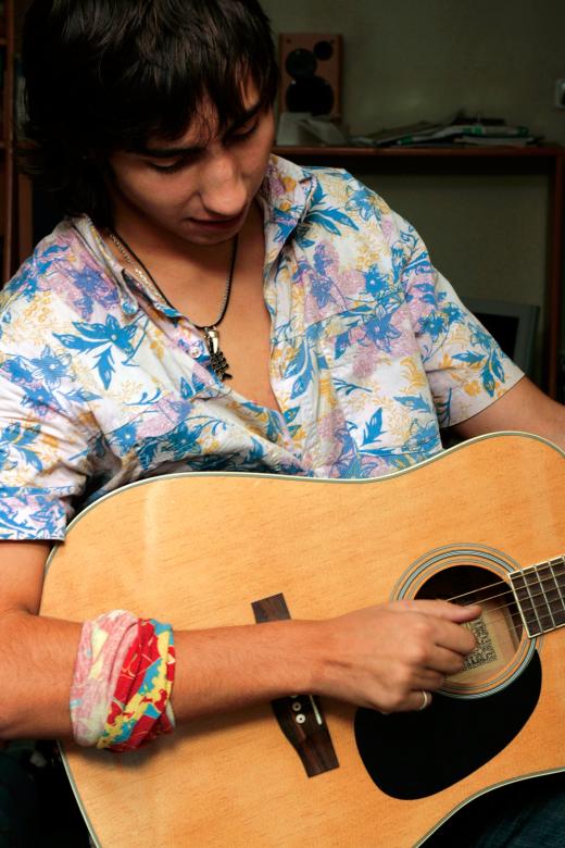 Free stock image of Boy playing guitar created by 2happy