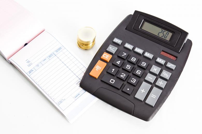 Free stock image of Receipt book with calculator and coins created by Geoffrey Whiteway
