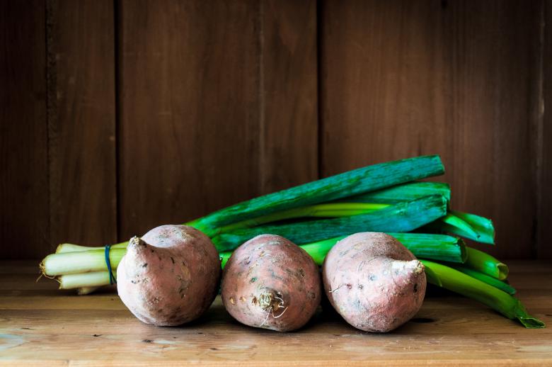 Free stock image of Sweet potatoes on wooden background created by Luka