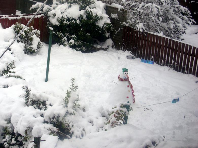 Free stock image of Snowman in a snow-covered garden created by Chas Mac