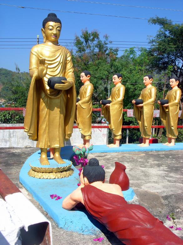Free stock image of Buddha and followers receiving offering from a devotee created by Chas Mac