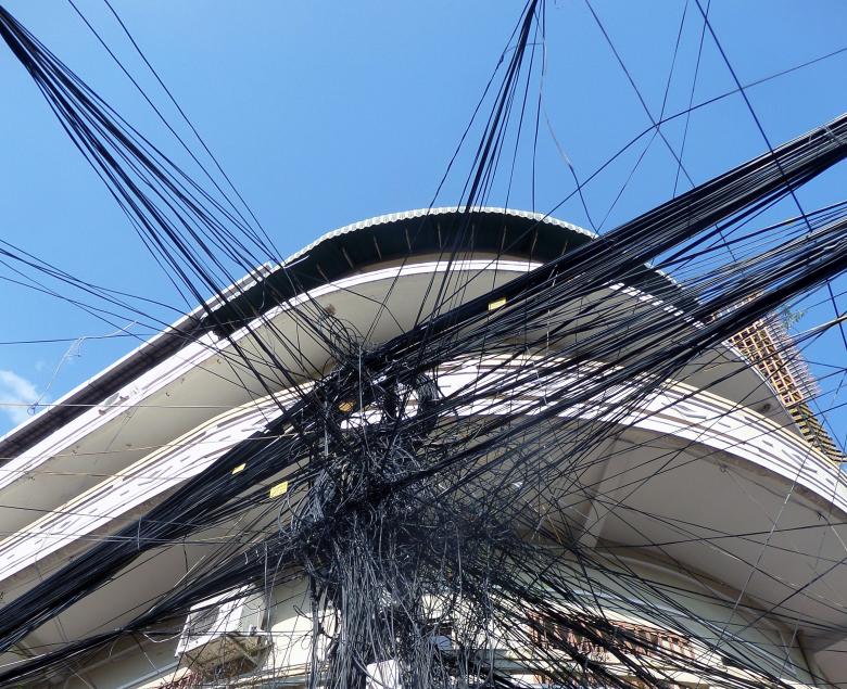 Free stock image of Chaotic Cambodian street cabling created by Chas Mac