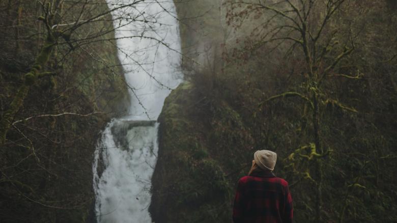 Free stock image of Woman by the Waterfall created by Unsplash