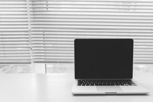 Laptop on desk with white space - Free Stock Photo