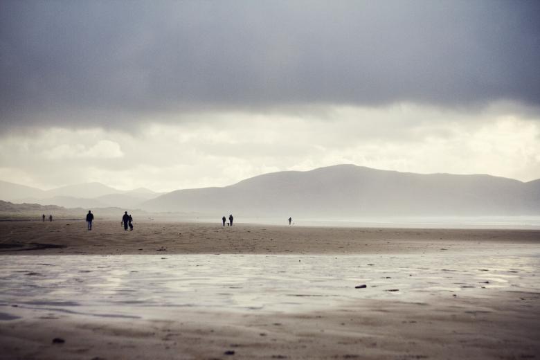 Free stock image of People walking on a beach created by Unsplash