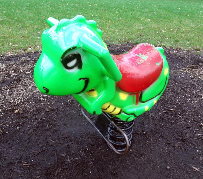 Free stock image of Green playground rocking dinosaur created by David M