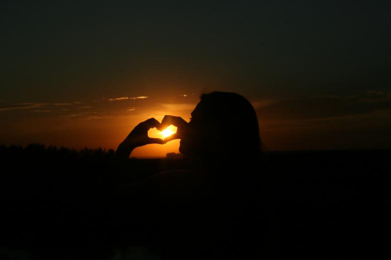 Free stock image of Girl making heart at sunset created by Pixabay