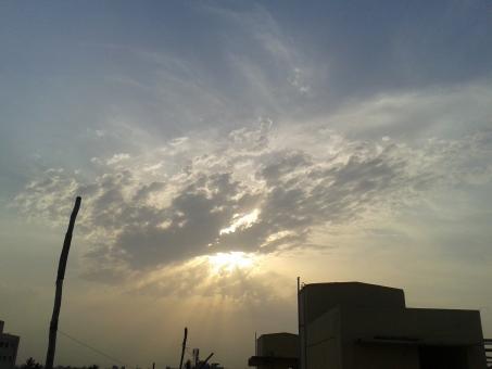 Clouds over sun - Free Stock Photo