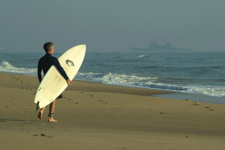 Free stock image of Surfer on the Beach created by Pixabay