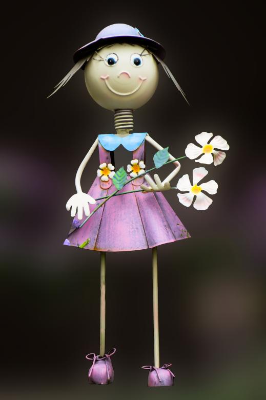 Free stock image of Figure holding Flowers created by Pixabay