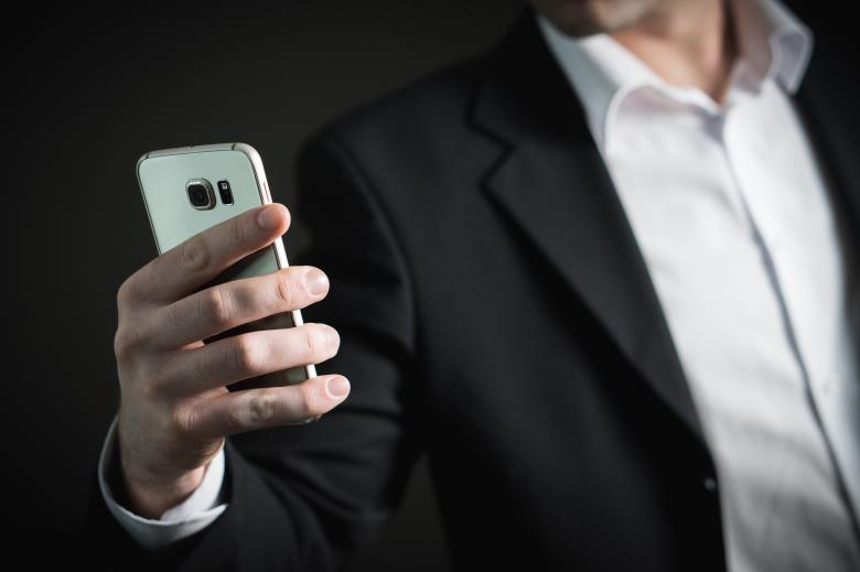 Free stock image of Businessman using Mobile created by Pixabay