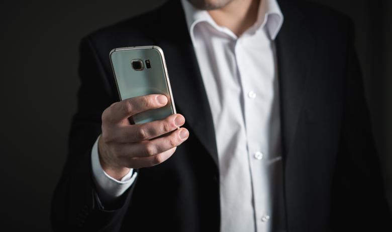 Free stock image of Businessman using Mobile created by Pixabay