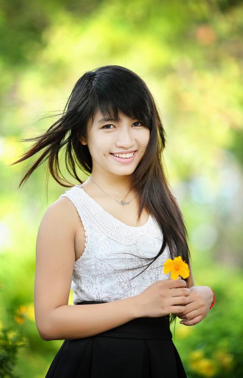 Free stock image of Girl with Flower created by Pixabay