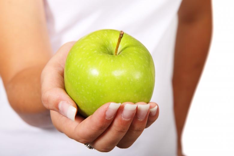 Free stock image of Holding Apple created by Pixabay