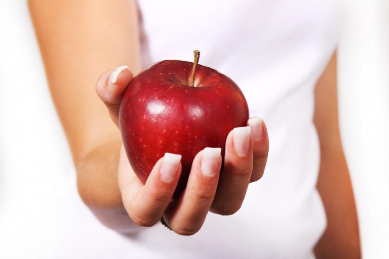 Free stock image of Holding Apple created by Pixabay